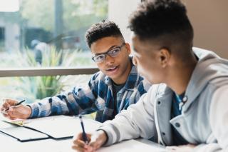 Two high school students studying