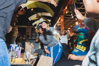 Coppin woman singing with friends